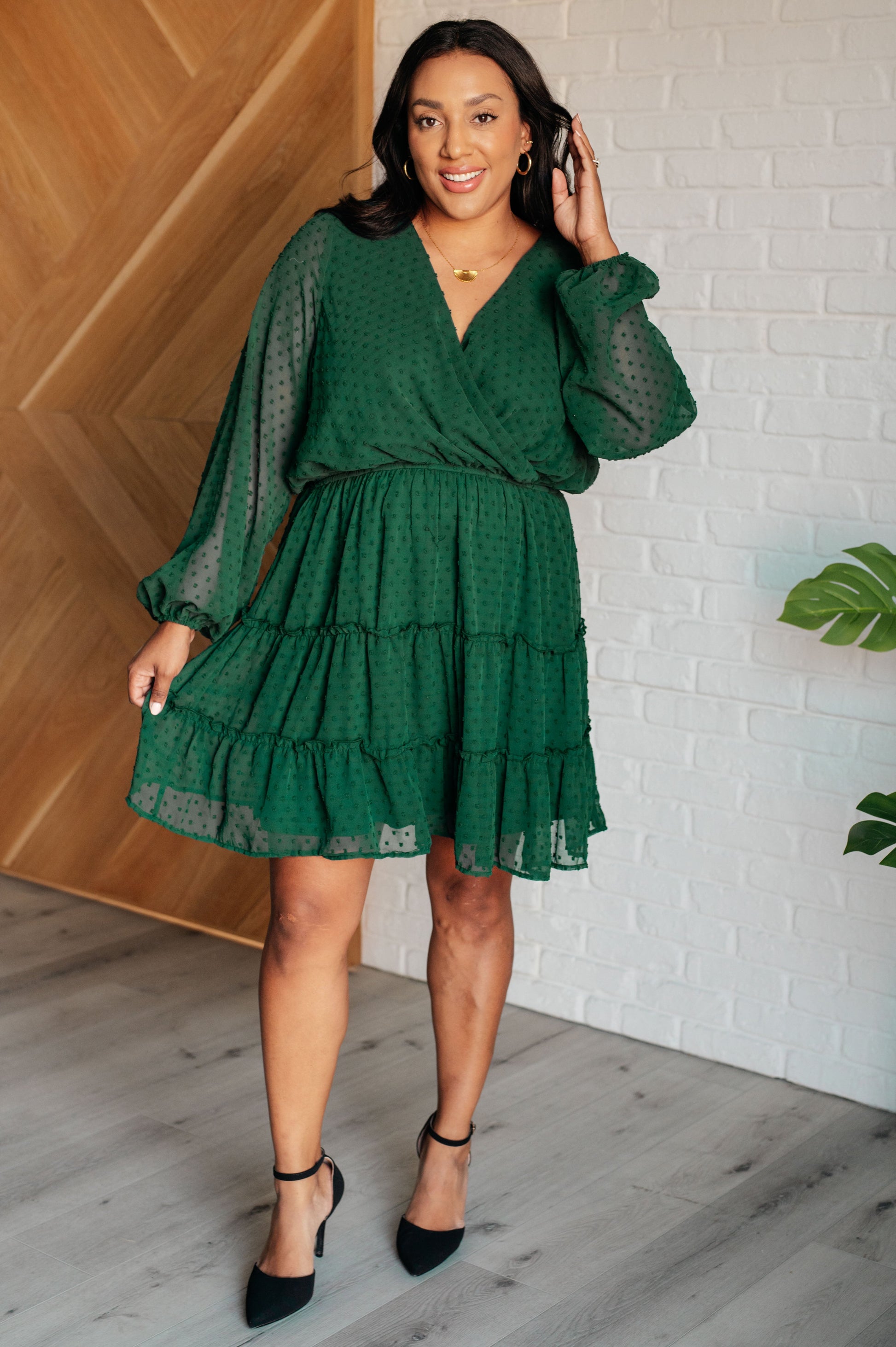 Women’s holiday party dress with flattering v-neck and tiered silhouette